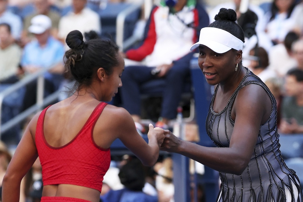 Venus Williams, of the United States, and Leylah Fernandez, of Canada, celebrate during their doubles match during the third round of the U.S. Open tennis championships, Saturday, Aug. 30, 2025, in New York. (AP Photo/Heather Khalifa)