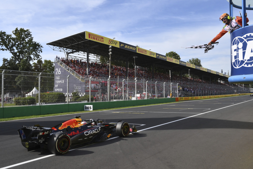 Red Bull driver Max Verstappen of the Netherlands crosses the finish line to win the Italian Grand Prix race at the Monza racetrack in Monza, Italy, Sunday, Sept. 7, 2025. (Marco Bertorello/Pool Photo via AP)