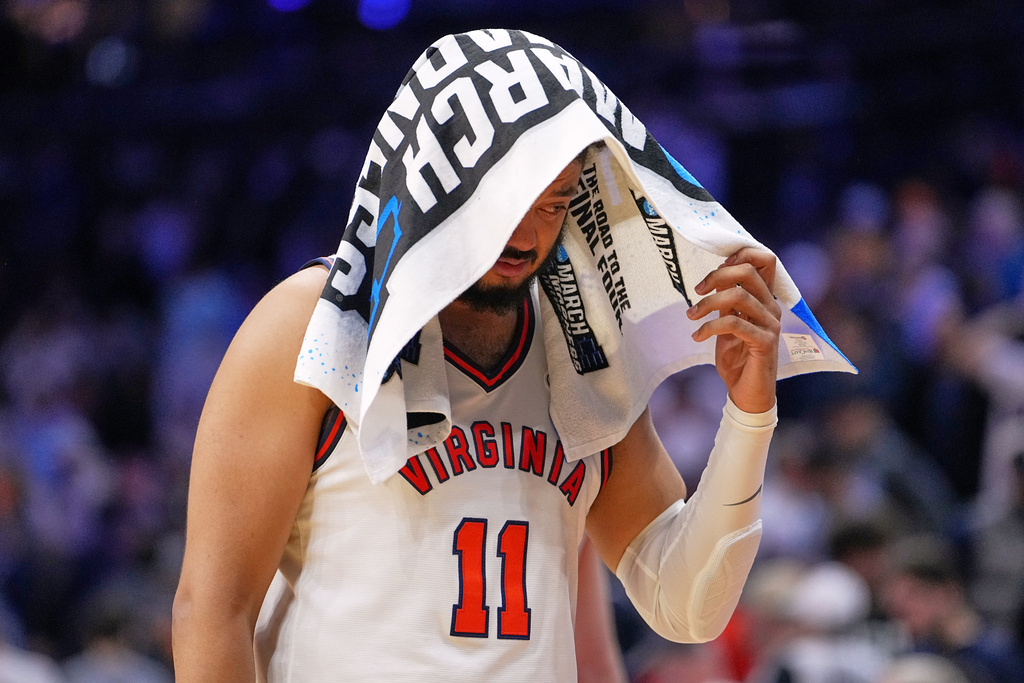 Virginia's Devin Tillis walks off the court after his team lost to Tennessee in the second round of the NCAA college basketball tournament, Sunday, March 22, 2026, in Philadelphia. (AP Photo/Matt Rourke)