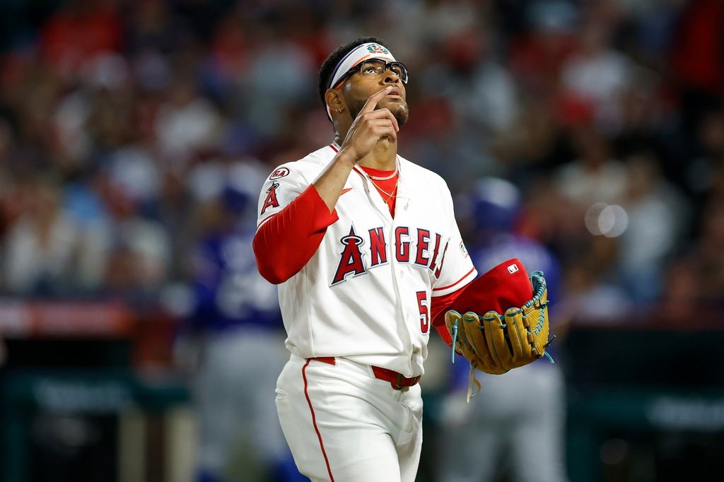 Los Angeles Angels starting pitcher Walbert Urena (57) reacts after stranding the bases loaded to end the fifth inning against the Texas Rangers, Saturday, May 23, 2026, in Anaheim, Calif. (AP Photo/Caroline Brehman)