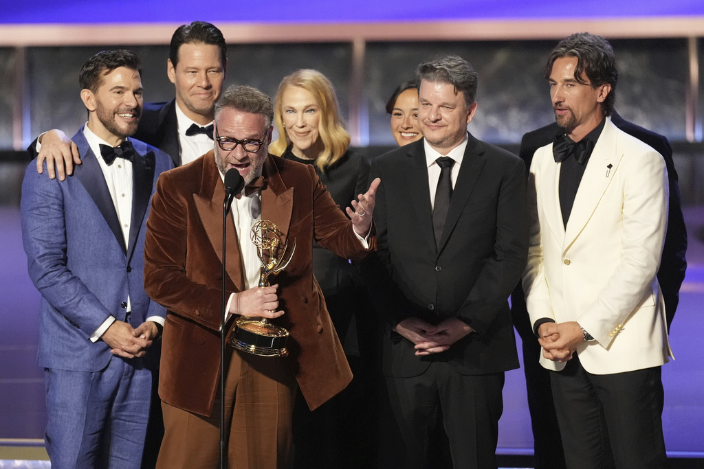 Seth Rogen, center, and the team from "The Studio" accept the award for outstanding comedy series during the 77th Primetime Emmy Awards on Sunday, Sept. 14, 2025, at the Peacock Theater in Los Angeles. (AP Photo/Chris Pizzello)