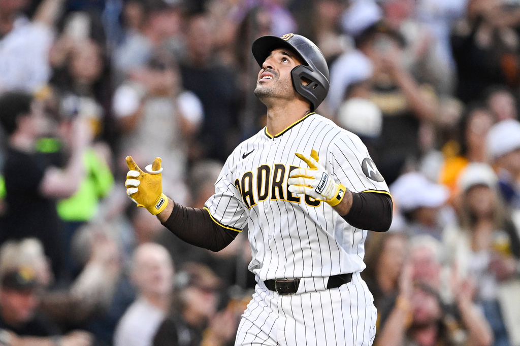 San Diego Padres' Ramón Laureano (5) looks skyward after hitting a three-run home run during the fourth inning of a baseball game against the Colorado Rockies Saturday, April 11, 2026, in San Diego. (AP Photo/Denis Poroy)