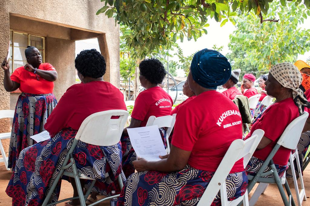 Kuchemana Burial Society secretary Nyadzisayi Mirisawu addresses fellow members at a meeting in Harare, Zimbabwe, March 13, 2026. (AP Photo/Aaron Ufumeli)