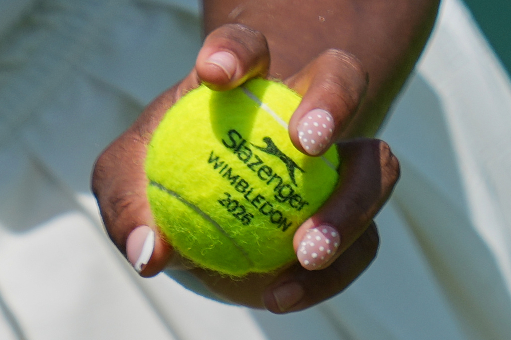 Serena Williams of the United States holds a ball during a practice session ahead of the Wimbledon Tennis Championships, in London, Wednesday, June 24, 2026. (AP Photo/Kin Cheung)