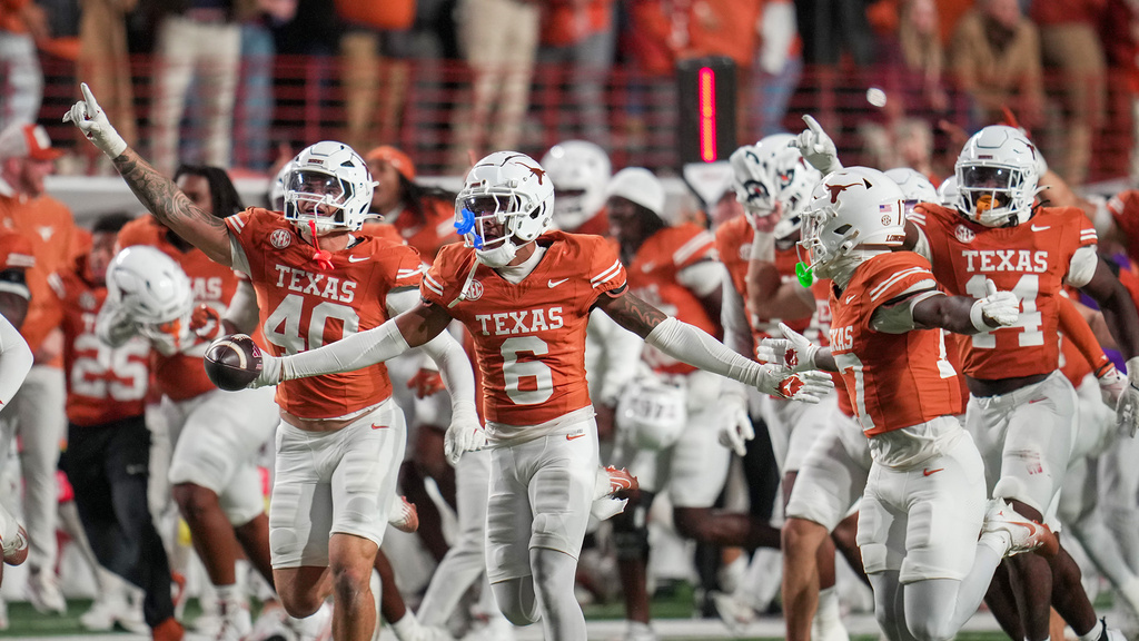 Texas Longhorns defensive back Kobe Black (6) celebrates an interception late in the 4th quarter against Texas A&M Aggies offense in an NCAA college football game in the Lone Star Showdown in Austin, Texas, Friday, Nov. 28, 2025. (Ricardo B. Brazziell/Austin American-Statesman via AP)