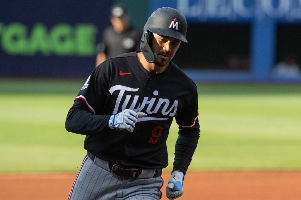 Minnesota Twins' Trevor Larnach rounds the bases after hitting a solo home run off Cleveland Guardians starting pitcher Slade Cecconi during the first inning of a baseball game, Wednesday, July 22, 2026, in Cleveland. (AP Photo/Phil Long)