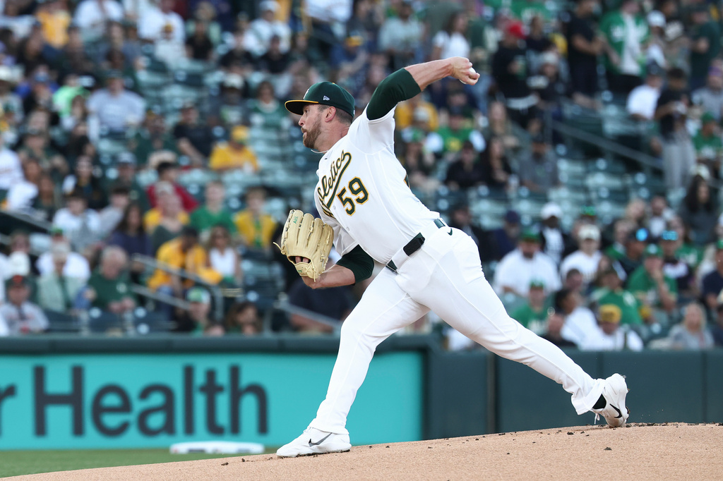 Athletics pitcher Jeffrey Springs throws to the Houston Astros during the first inning of a home-opener baseball game Friday, April 3, 2026, in West Sacramento, Calif. (AP Photo/Sara Nevis)