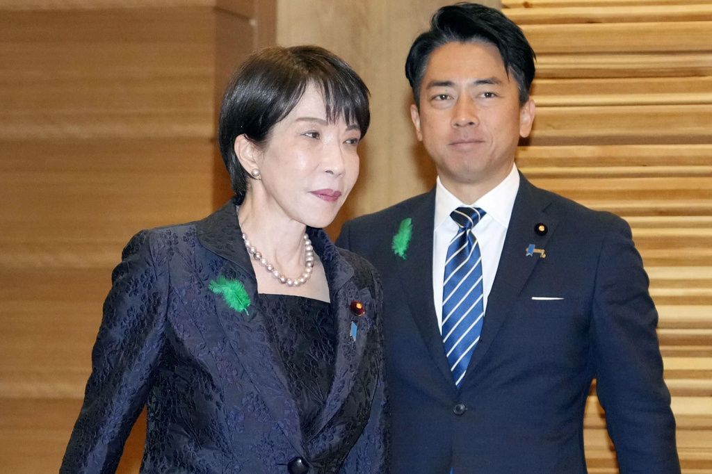 Japan’s Prime Minister Sanae Takaichi, left, and Defense Miniser Shinjiro Koizumi, right, arrive for a cabinet meeting at the prime minster's office in Tokyo, Tuesday, April 21, 2026.(Kyodo News via AP)