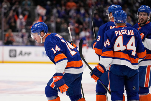 New York Islanders' Bo Horvat (14) celebrates with teammates after scoring a goal during the second period of an NHL hockey game against the Edmonton Oilers Thursday, Oct. 16, 2025, in Elmont, N.Y. (AP Photo/Frank Franklin II) New York Islanders' Bo Horvat (14) celebrates with teammates after scoring a goal during the second period of an NHL hockey game against the Edmonton Oilers Thursday, Oct. 16, 2025, in Elmont, N.Y. (AP Photo/Frank Franklin II)