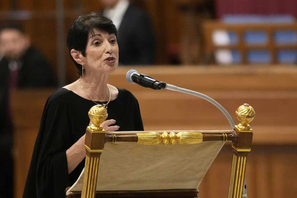 Diane Foley, the mother of James Foley, who was kidnapped and beheaded by Islamic militants in 2014 while reporting on the conflict in Syria, speaks as Pope Leo XIV presides over a vigil prayer for the consolation of those who suffer, at The Vatican, Monday, Sept. 15, 2025. (AP Photo/Gregorio Borgia)