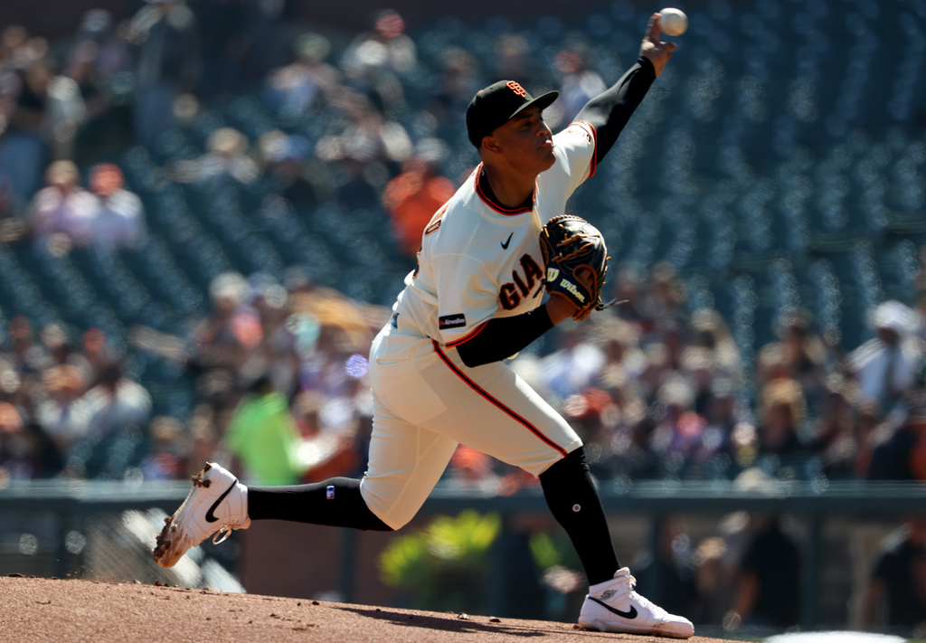 San Francisco Giants pitcher Cesar Perdomo throws against the Minnesota Twins during the first inning of a baseball game in San Francisco, Wednesday, Sept. 23, 2026. (AP Photo/Jed Jacobsohn)