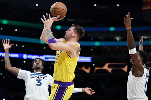 Los Angeles Lakers guard Luka Doncic, center, shoots against Minnesota Timberwolves forward Jaden McDaniels (3) as guard Anthony Edwards, right, watches during the first half of an NBA basketball game, Friday, Oct. 24, 2025, in Los Angeles. (AP Photo/Jessie Alcheh) Los Angeles Lakers guard Luka Doncic, center, shoots against Minnesota Timberwolves forward Jaden McDaniels (3) as guard Anthony Edwards, right, watches during the first half of an NBA basketball game, Friday, Oct. 24, 2025, in Los Angeles. (AP Photo/Jessie Alcheh)
