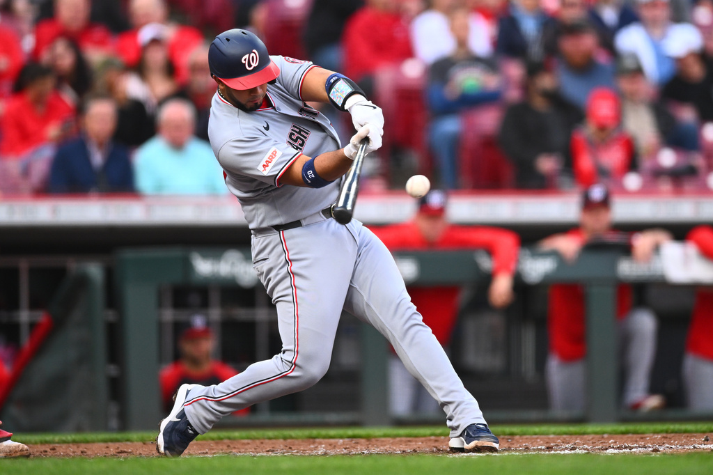 Washington Nationals' Keibert Ruiz (20) hits a two-run home run during the second inning of a baseball game against the Cincinnati Reds in Cincinnati, Wednesday, May 13, 2026. (AP Photo/Ben Jackson)