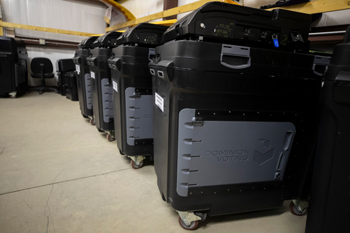 FILE - Dominion Voting ballot counting machines are lined up at a Torrance County warehouse during a testing of election equipment in Estancia, N.M., Sept. 29, 2022.(AP Photo/Andres Leighton, File) FILE - Dominion Voting ballot counting machines are lined up at a Torrance County warehouse during a testing of election equipment in Estancia, N.M., Sept. 29, 2022.(AP Photo/Andres Leighton, File)