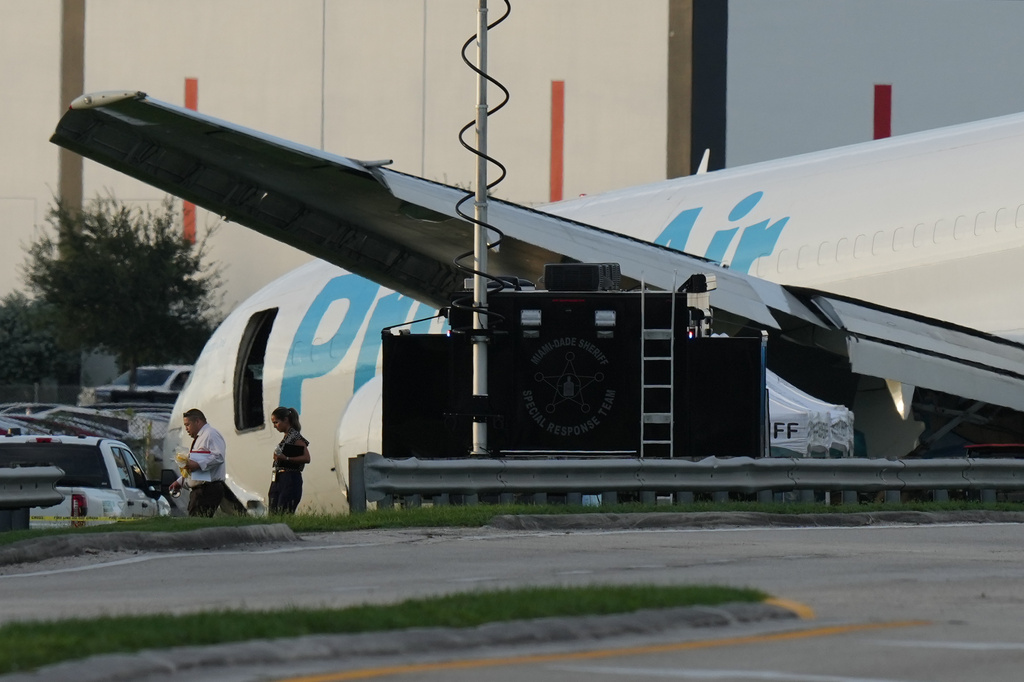An Amazon cargo plane sits at the Miami International Airport (MIA) after it overshot the runway, Sunday, Sept. 6, 2026. (AP Photo/Lynne Sladky)