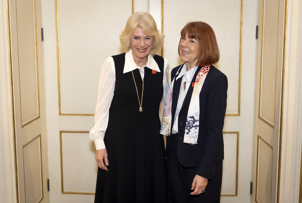 Britain's Queen Camilla, left, with Gisele Pelicot during an audience at Clarence House in London, Monday Feb. 23, 2026. (Aaron Chown/Pool Photo via AP)