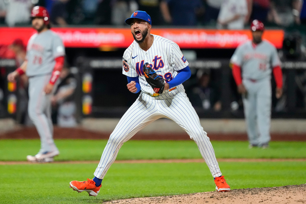 New York Mets pitcher Devin Williams (38) reacts after winning a baseball game against the Cincinnati Reds, Wednesday, May 27, 2026, in New York. (AP Photo/Yuki Iwamura)