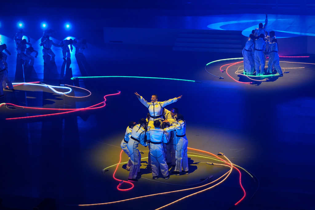 Dancers perform during the closing ceremony at the 2026 Winter Paralympics, in Cortina d'Ampezzo, Italy, Sunday, March 15, 2026. (AP Photo/Evgeniy Maloletka)
