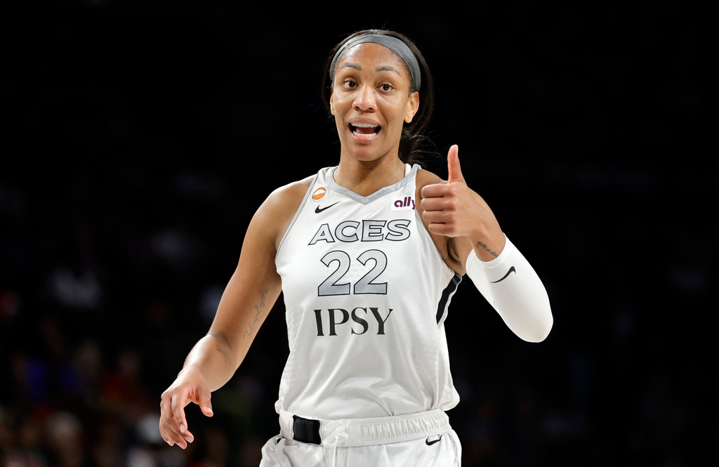 Las Vegas Aces center A'ja Wilson (22) gives a thumbs up during the first half of an WNBA basketball game against the Portland Fire Tuesday, July 28, 2026, in Las Vegas. (Steve Marcus/Las Vegas Sun via AP)
