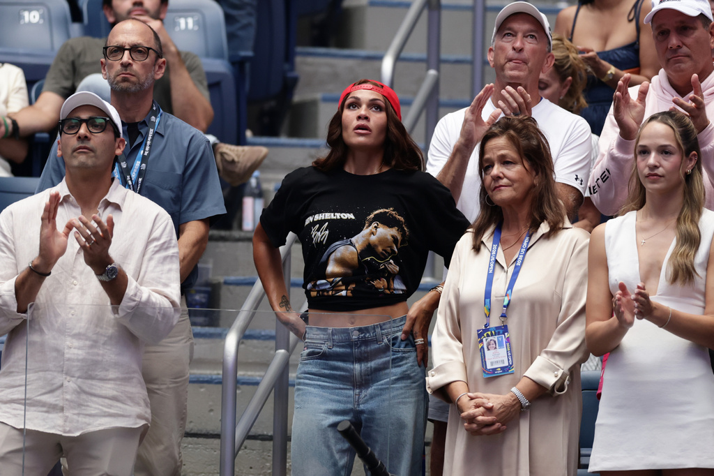 Soccer player Trinity Rodman, center, reacts after her boyfriend Ben Shelton, of the United States, lost the men's singles final of the U.S. Open tennis championships against Alexander Zverev, of Germany, Sunday, Sept. 13, 2026, in New York. (AP Photo/Adam Hunger)