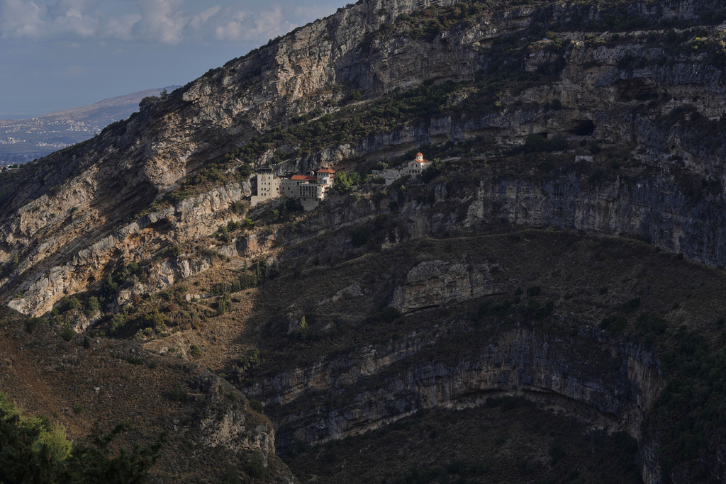 The Hamatoura Monastery, one of several monastic communities built into the cliffs of the scenic Qadisha Valley, a site considered sacred by Lebanon's Maronite Christians, is seen above the northeastern mountain town of Kousba, Lebanon, Saturday, Nov. 15, 2025. (AP Photo/Hassan Ammar)