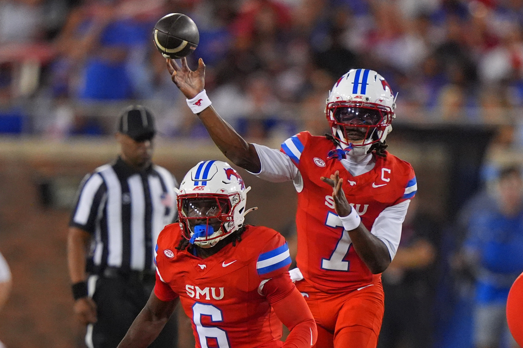 SMU quarterback Kevin Jennings (7) passes from behind running back Kendrick Raphael (6) during the first half of an NCAA college football game against Missouri State Saturday, Sept. 26, 2026, in Dallas. (AP Photo/LM Otero)