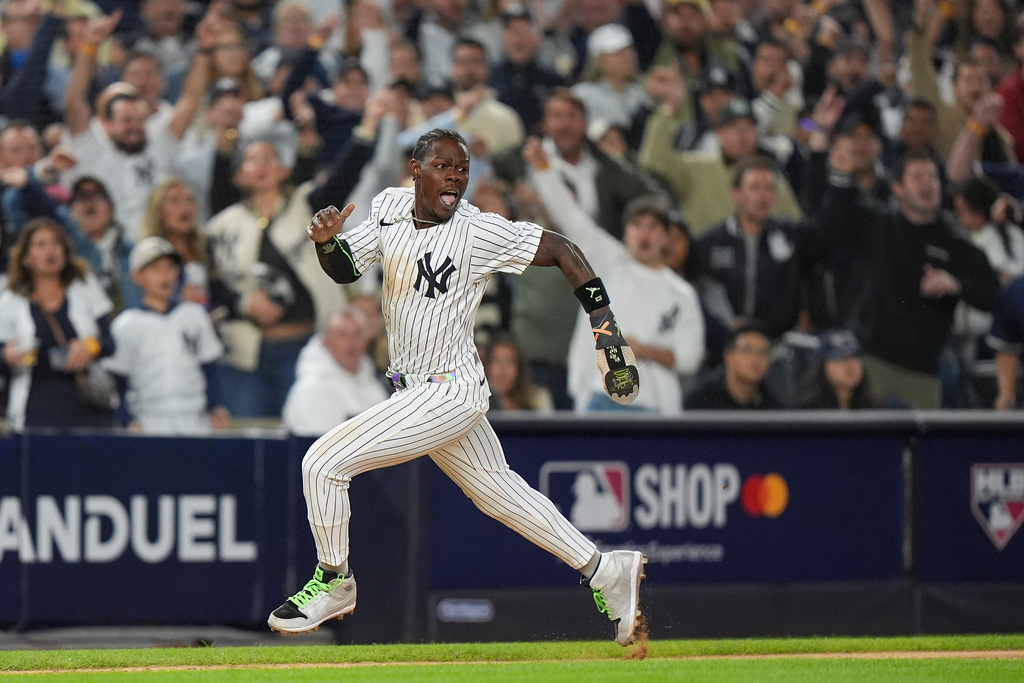 New York Yankees Jazz Chisholm Jr. rounds third base on his way home to score on a base hit by Austin Wells against the Boston Red Sox during the eighth inning of Game 2 of an American League wild-card baseball playoff series, Wednesday, Oct. 1, 2025, in New York. (AP Photo/Frank Franklin II)