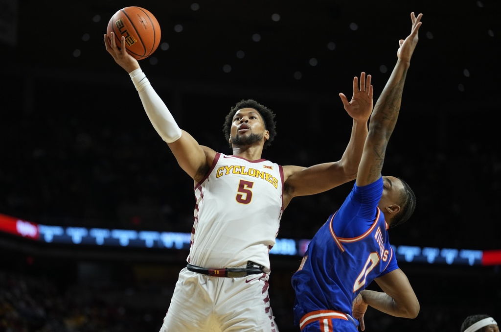 Iowa State forward Joshua Jefferson (5) pulls up for a shot as Houston Christian guard Demari Williams (0) defends during the first half of an NCAA college basketball game, Monday, Dec. 29, 2025, in Ames, Iowa. (AP Photo/Matthew Putney)