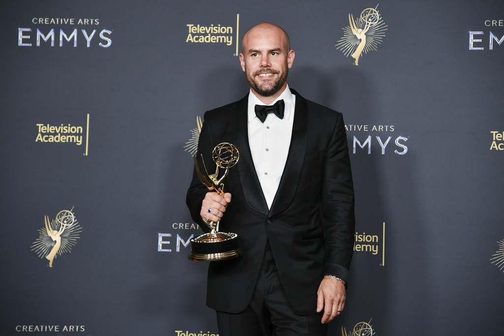 CORRECTS YEAR - Adam Newport-Berra poses in the press room with the award for outstanding cinematography for a series (half-hour) for "The Studio" during night one of the Creative Arts Emmy Awards on Saturday, Sept. 6, 2025, in Los Angeles. (Photo by Richard Shotwell/Invision/AP)