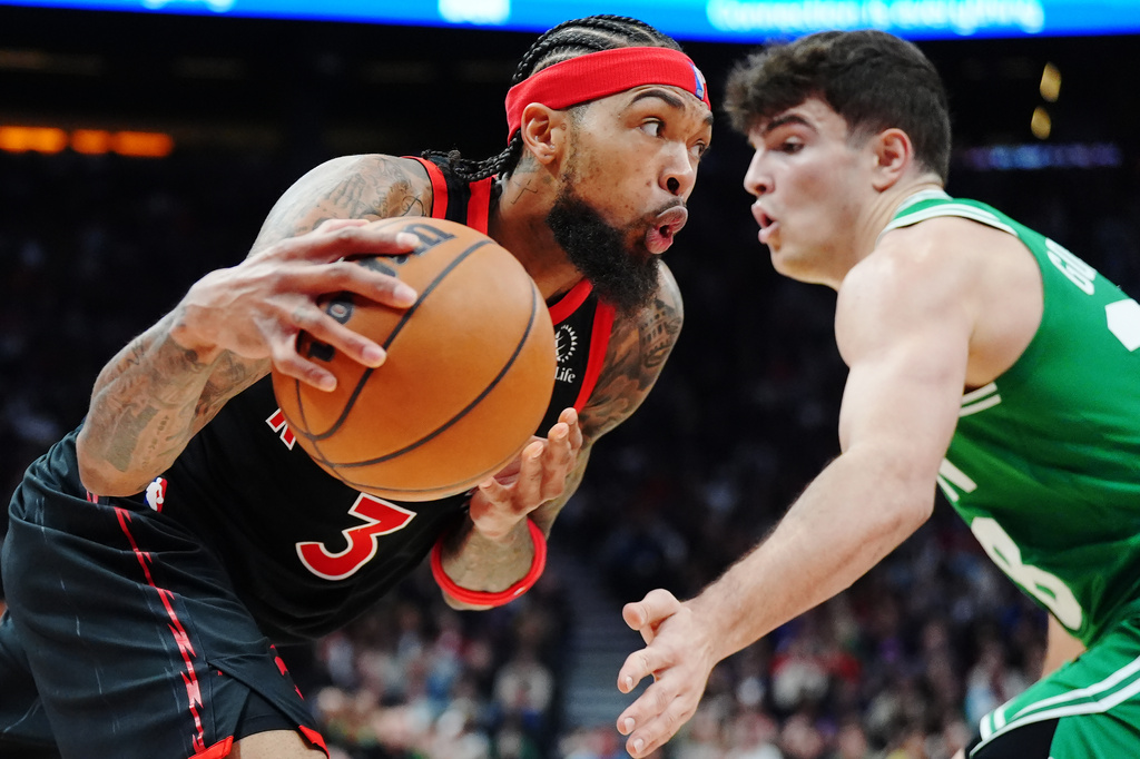 Toronto Raptors' Brandon Ingram (3) drives against Boston Celtics' Hugo Gonzalez, right, during first-half NBA basketball game action in Toronto, Saturday, Dec. 20, 2025. (Frank Gunn/The Canadian Press via AP)