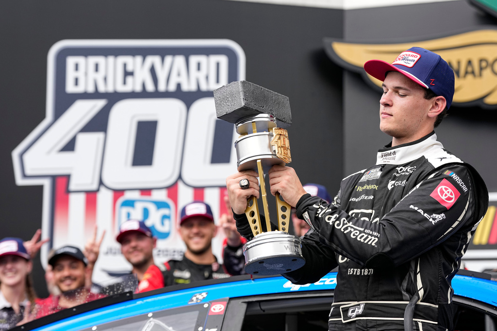 Corey Heim celebrates after winning a NASCAR Cup Series auto race at Indianapolis Motor Speedway in Indianapolis, Sunday, July 26, 2026. (AP Photo/Michael Conroy)