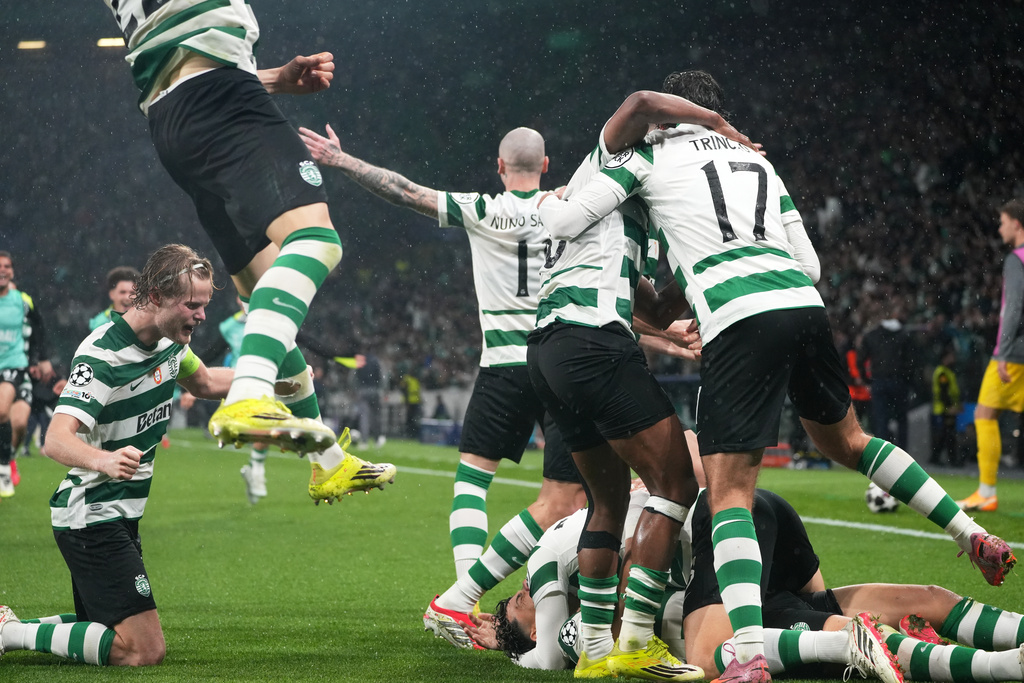 Sporting CP players celebrate after Sporting's Maximiliano Araujo scored his side's fourth goal during a Champions League round of 16 second leg soccer match between Sporting CP and Bodo Glimt in Lisbon, Portugal, Tuesday, March 17, 2026. (AP Photo/Ana Brigida)