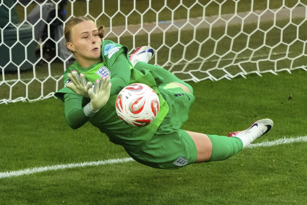 FILE - England goalkeeper Hannah Hampton stops a shot from Spain's Aitana Bonmati during a penalty shootout at the end of the Women's Euro 2025 final soccer match between England and Spain at St. Jakob-Park in Basel, Switzerland, Sunday, July 27, 2025. (AP Photo/Michael Probst, File)