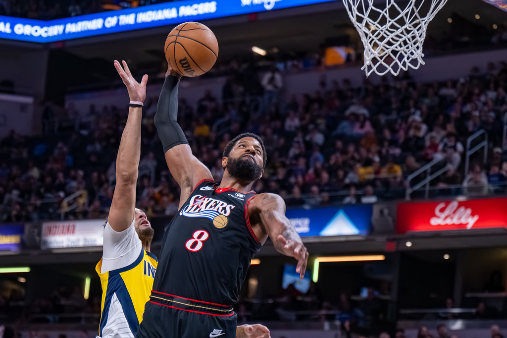 Philadelphia 76ers forward Paul George (8) prepares to dunk during the first half of an NBA basketball game against the Indiana Pacers in Indianapolis, Friday, April 10, 2026. (AP Photo/Doug McSchooler)