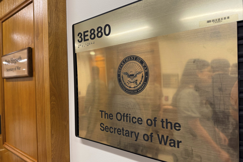 A new sign hangs at the Pentagon after President Donald Trump signed an executive order aiming to rename the Department of Defense the Department of War in Washington, Friday, Sept. 5, 2025. (AP Photo/Mike Pesoli)