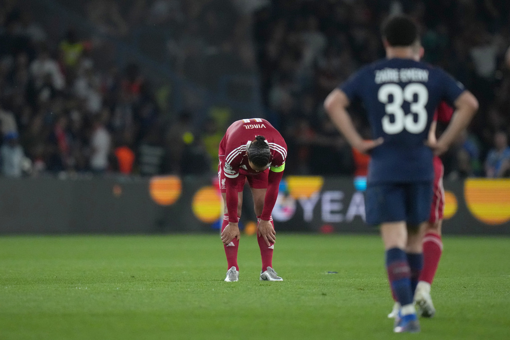 Liverpool's Virgil van Dijk, center, reacts at the end of the Champions League quarterfinal first leg soccer match between Paris Saint-Germain and Liverpool in Paris, Wednesday, April 8, 2026. (AP Photo/Thibault Camus)