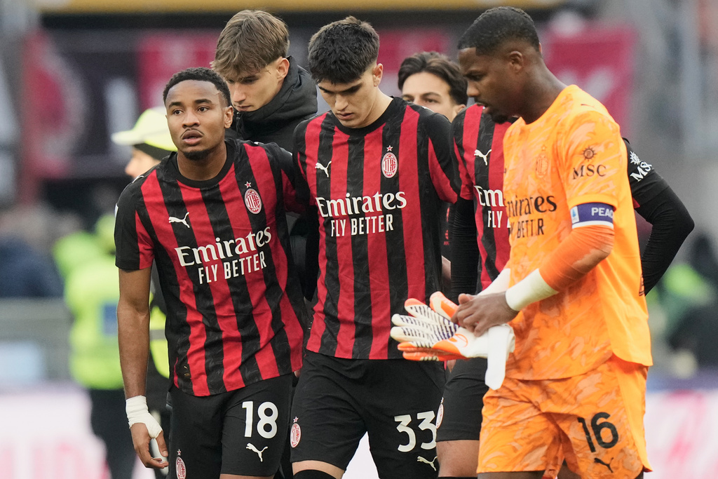 AC Milan players leave the field after the Serie A soccer match between AC Milan and Sassuolo, in Milan, Italy, Sunday, Dec. 14, 2025. (AP Photo/Luca Bruno)