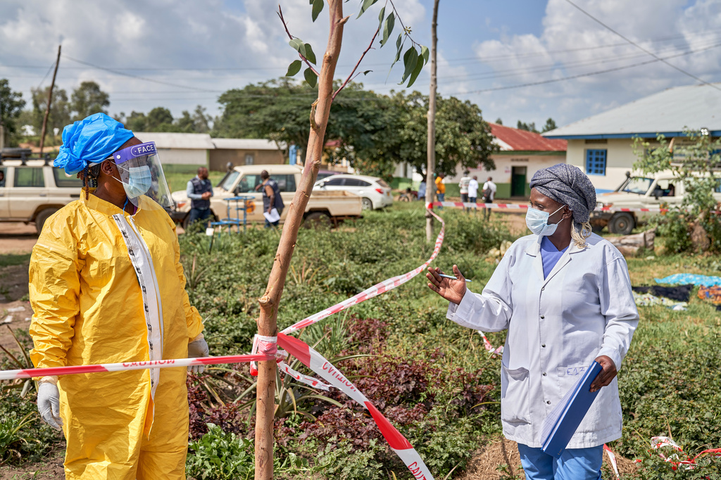 Health workers chat at an Ebola treatment center in Bunia, Congo, Tuesday, May 19, 2026. (AP Photo/Dirole Lotsima Dieudonne)