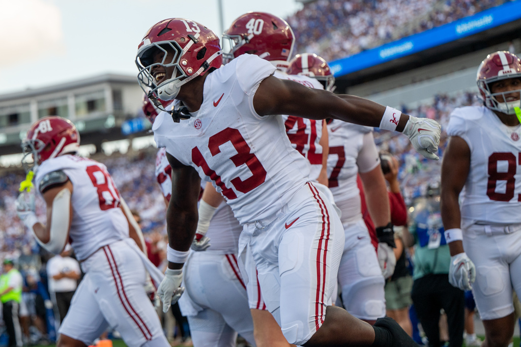 Alabama running back EJ Crowell (13) celebrates after a touchdown during the second half of an NCAA college football game against Kentucky, Saturday, Sept. 12, 2026, in Lexington, Ky. (AP Photo/Tony Wagner)