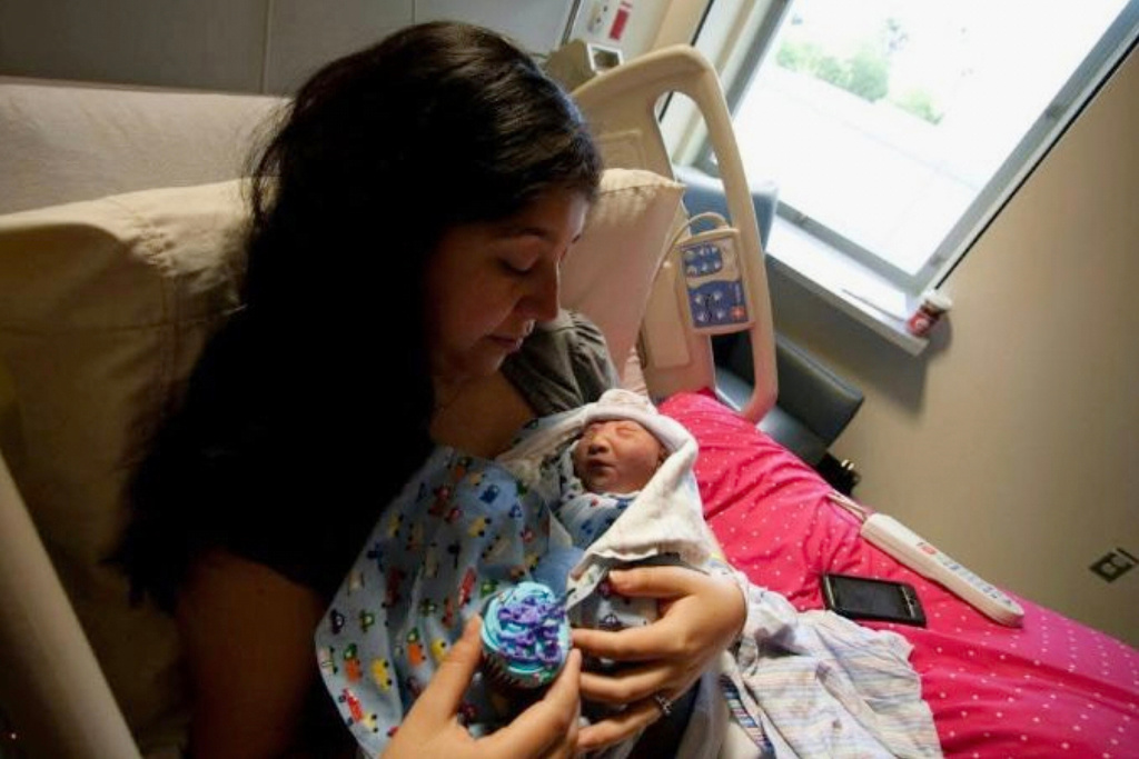 In this photo provided by Andrea Lopez, she cradles her son, Gabriel Cude, at a hospital Bakersfield, Calif., in 2011, where he was born with anencephaly, a rare and severe birth defect tied to a lack of folic acid, a key vitamin. (Courtesy Andrea Lopez via AP) CORRECTION: Corrects last name to Cude, instead of Crude.