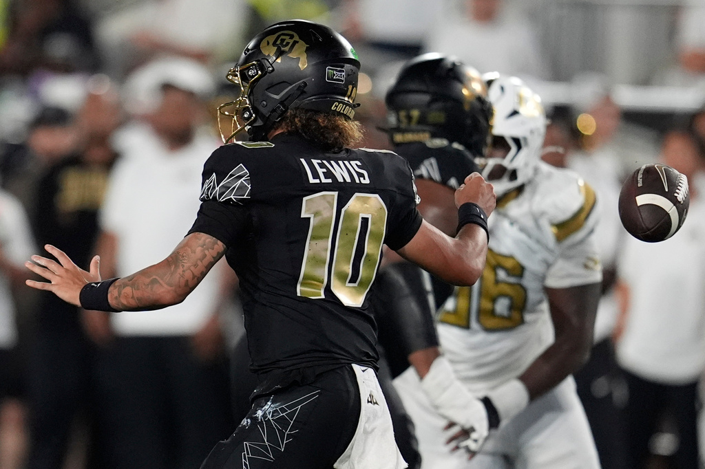 Colorado quarterback Julian Lewis (10) loses the ball whilst passing against Georgia Tech during the first half of an NCAA college football game, Thursday, Sept. 3, 2026, in Atlanta. (AP Photo/Mike Stewart)
