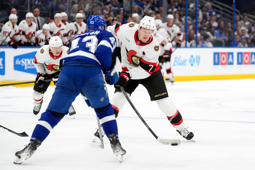 Ottawa Senators left wing Brady Tkachuk (7) shoots in front of Tampa Bay Lightning defenseman Darren Raddysh (43) during the third period of an NHL hockey game Thursday, Oct. 9, 2025, in Tampa, Fla. (AP Photo/Chris O'Meara) Ottawa Senators left wing Brady Tkachuk (7) shoots in front of Tampa Bay Lightning defenseman Darren Raddysh (43) during the third period of an NHL hockey game Thursday, Oct. 9, 2025, in Tampa, Fla. (AP Photo/Chris O'Meara)