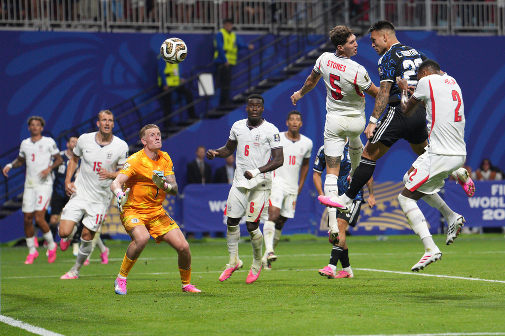 Argentina's Lautaro Martinez (22) heads the ball to score his side's second goal during the World Cup semifinal soccer match between England and Argentina in Atlanta, Wednesday, July 15, 2026. (AP Photo/Jacob Kupferman)