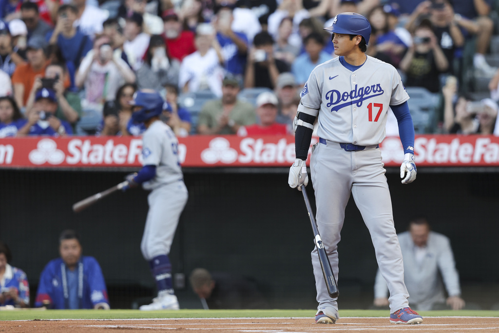 Los Angeles Dodgers designated hitter Shohei Ohtani (17) prepares to bat during the first inning of a baseball game against the Los Angeles Angels, Monday, Aug. 11, 2025, in Anaheim, Calif. (AP Photo/Jessie Alcheh)