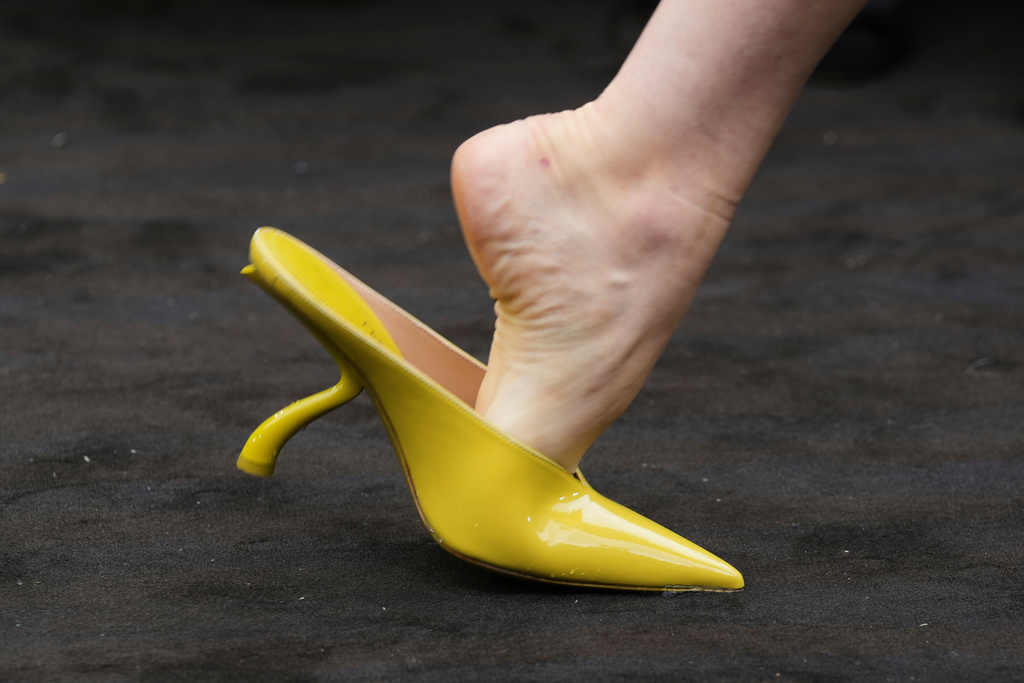 A model wears a creation part of the Ferragamo women's Spring-Summer 2026 collection, that was presented in Milan, Italy, Saturday, Sept. 27, 2025. (AP Photo/Luca Bruno).