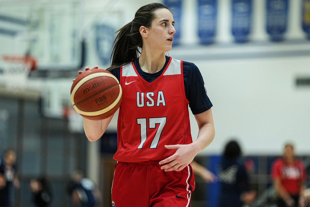 FILE - Caitlin Clark (17) brings the ball upcourt during a training camp for the U.S women's national basketball team, Friday, Dec. 12, 2025, in Durham, N.C. (AP Photo/Matt Kelley, File)