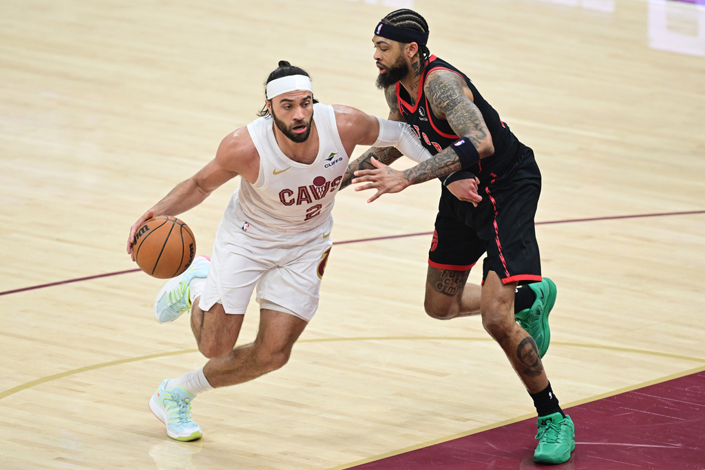 Cleveland Cavaliers guard Max Strus drives on Toronto Raptors forward Brandon Ingram during the first half in Game 5 of a first-round NBA playoffs basketball series, Wednesday, April 29, 2026, In Cleveland. (AP Photo/David Dermer)