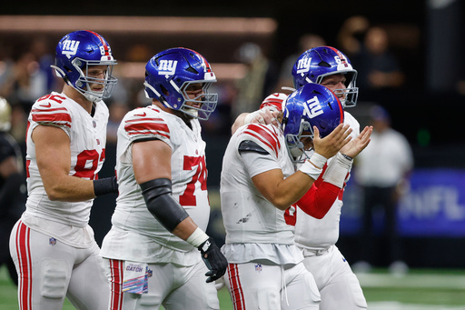 New York Giants quarterback Jaxson Dart reacts after his fumble in the second half of an NFL football game against the New Orleans Saints in New Orleans, Sunday, Oct. 5, 2025. (AP Photo/Butch Dill) New York Giants quarterback Jaxson Dart reacts after his fumble in the second half of an NFL football game against the New Orleans Saints in New Orleans, Sunday, Oct. 5, 2025. (AP Photo/Butch Dill)