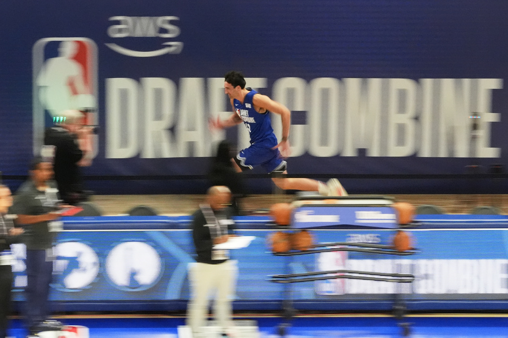 Milan Momcilovic, center top, participates in the NBA basketball draft combine in Chicago, Monday, May 11, 2026. (AP Photo/Nam Y. Huh)