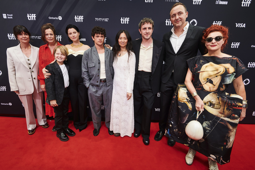 Producer Liza Marshall, left to right, actor Emily Watson, actor Jacobi Jupe, actor Jessie Buckley, actor Noah Jupe, director Chloé Zhao, actor Paul Mescal, producer Nic Gonda and costume designer Malgosia Turzanska are photographed on the red carpet for the film "Hamnet" during the Toronto International Film Festival in Toronto, on Sunday, Sept. 7, 2025. (Sammy Kogan/The Canadian Press via AP)